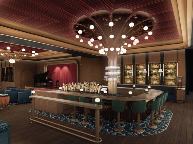 bar featuring hardwood / wood-style floors and a tray ceiling