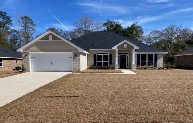 4218 Leslies Way, Dickinson, TX 77539 - craftsman house with an attached garage, brick siding, and concrete driveway