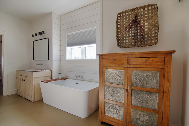 full bath featuring a soaking tub