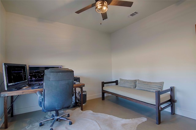 office space featuring visible vents, baseboards, and a ceiling fan
