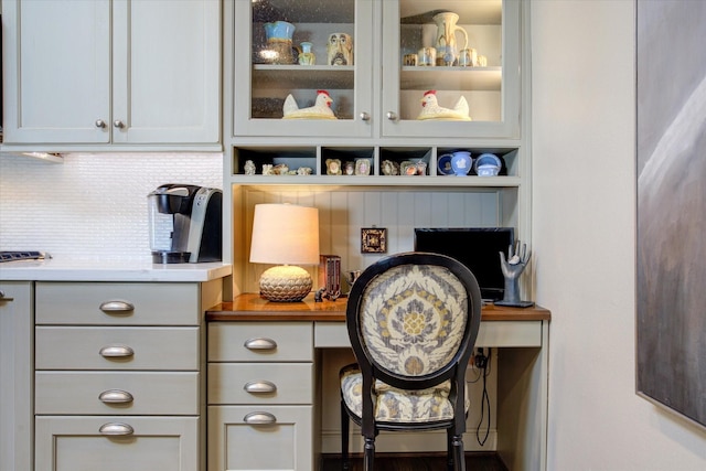 details with built in desk and decorative backsplash
