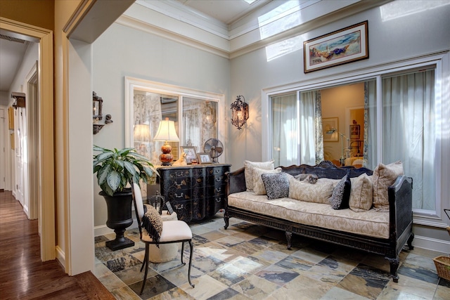 sitting room with ornamental molding