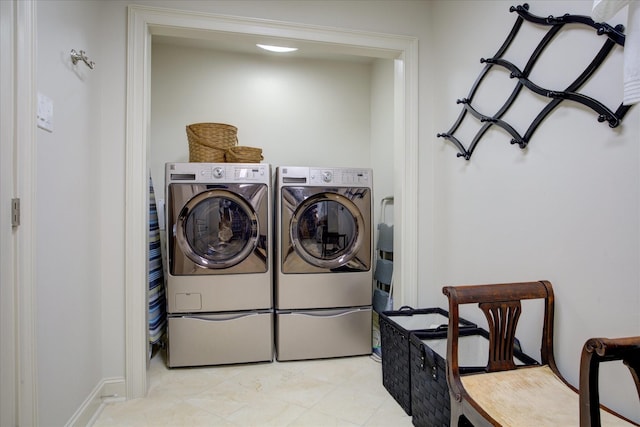 clothes washing area featuring washing machine and dryer