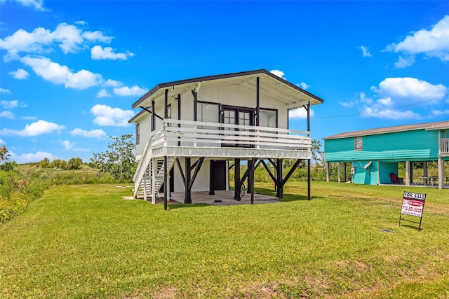 back of property featuring a lawn