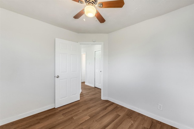 spare room featuring hardwood / wood-style floors and ceiling fan