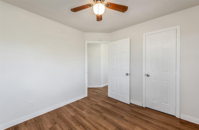 unfurnished bedroom with hardwood / wood-style floors and ceiling fan