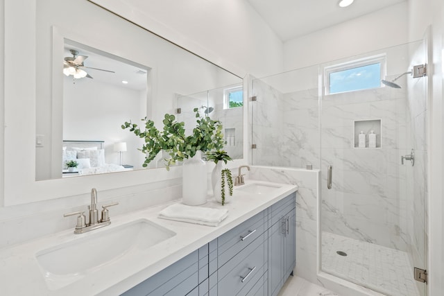 bathroom with vanity, plenty of natural light, a shower with door, and ceiling fan