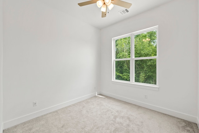 carpeted empty room with ceiling fan