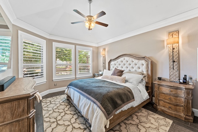 bedroom with hardwood / wood-style flooring, ornamental molding, and ceiling fan