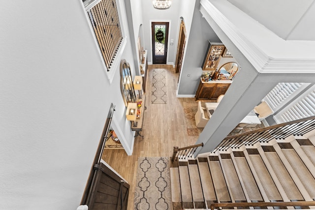 entrance foyer featuring hardwood / wood-style floors and a notable chandelier