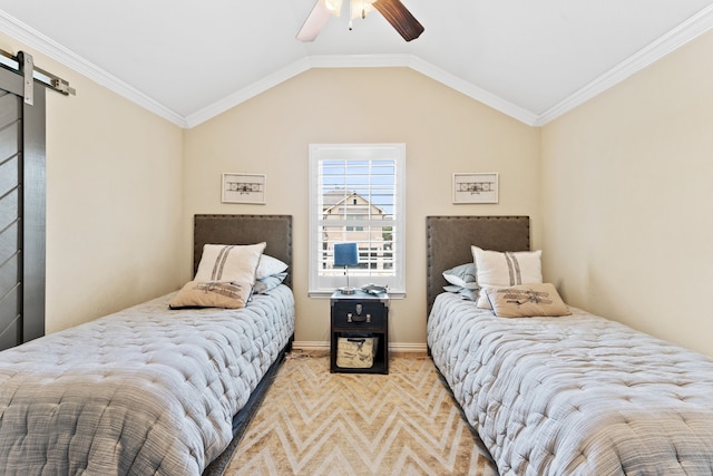 carpeted bedroom with lofted ceiling, a barn door, a ceiling fan, and crown molding