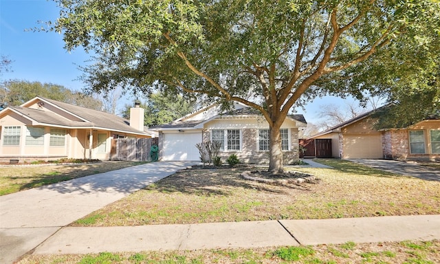 view of front of property with a garage and a front yard