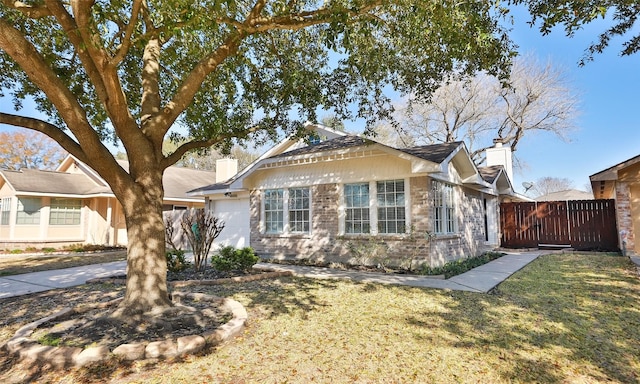 view of front of home with a garage and a front yard