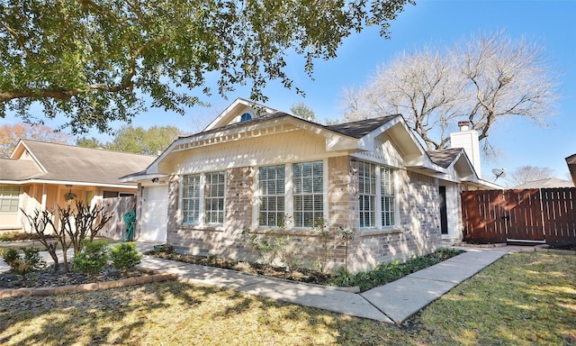 view of side of home with a yard