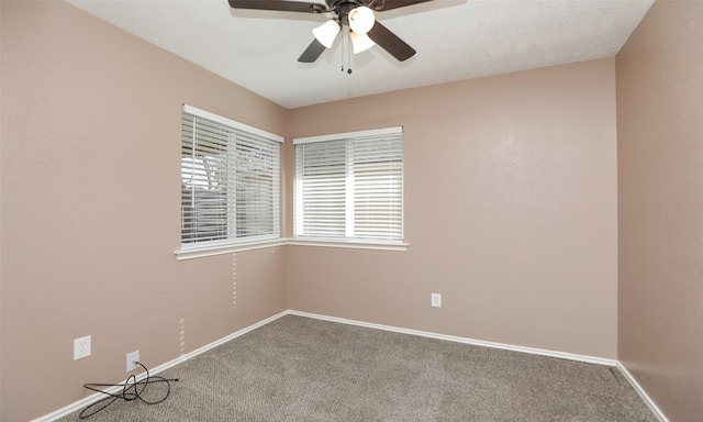 carpeted empty room with ceiling fan