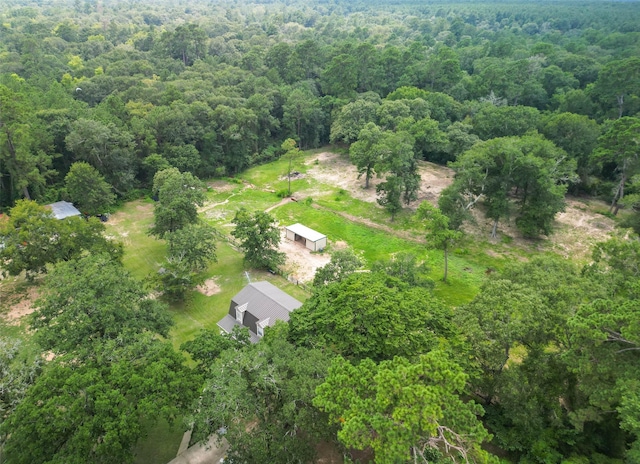 drone / aerial view featuring a forest view