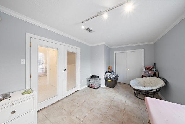 interior space featuring light tile patterned floors and french doors