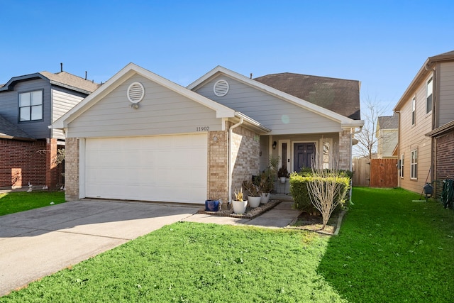 view of front facade with a garage and a front yard