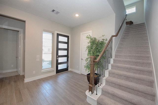 foyer entrance featuring hardwood / wood-style floors