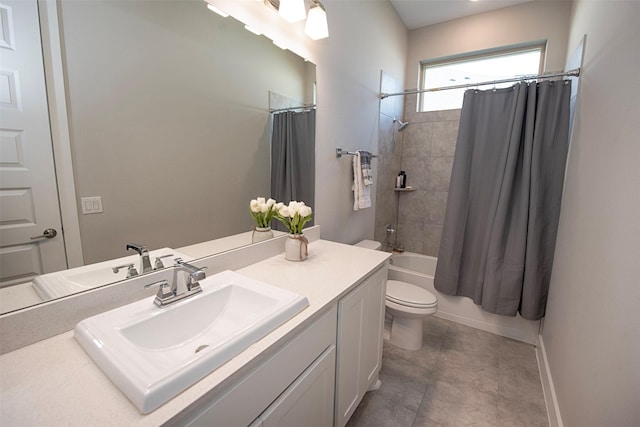 full bathroom featuring tile patterned flooring, vanity, toilet, and shower / bath combo with shower curtain