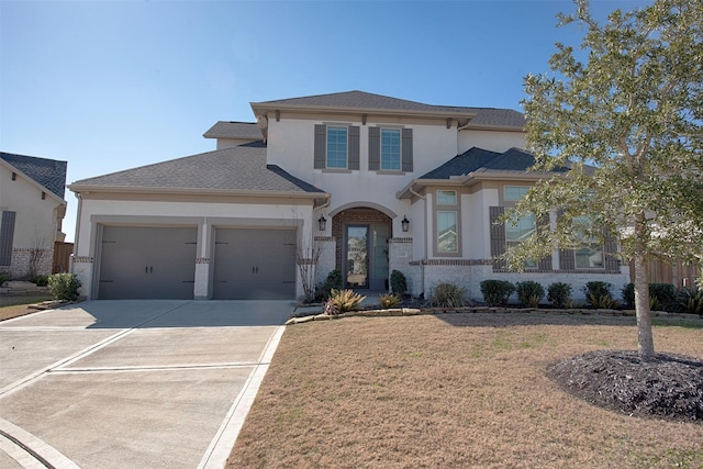 view of front of house featuring a garage and a front yard