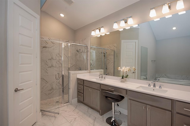 bathroom featuring plus walk in shower, lofted ceiling, and vanity