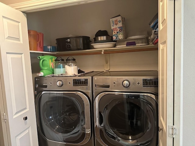 laundry room with washing machine and clothes dryer