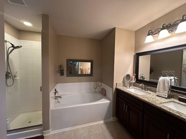 bathroom with shower with separate bathtub and vanity