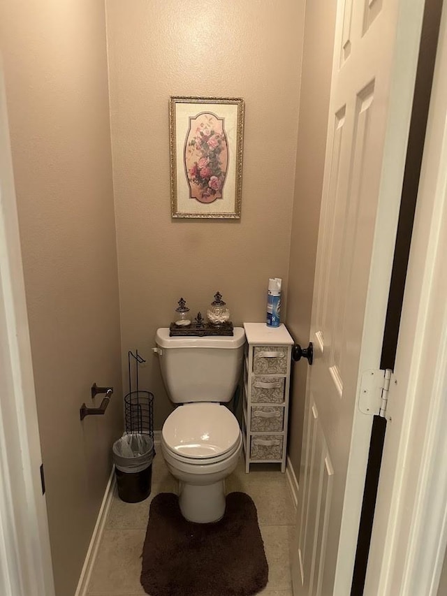 bathroom featuring tile patterned floors and toilet