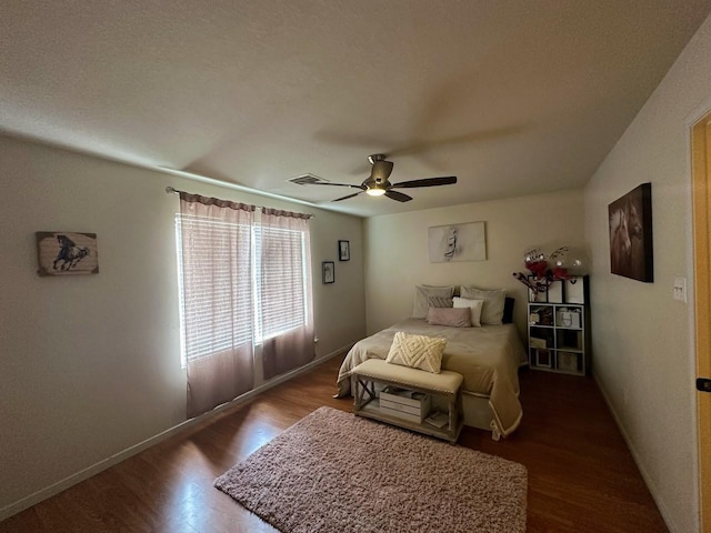 bedroom with wood-type flooring and ceiling fan