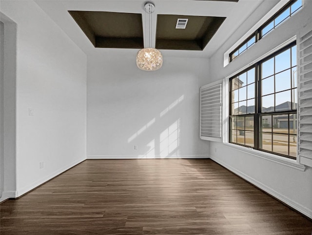 empty room featuring dark hardwood / wood-style flooring