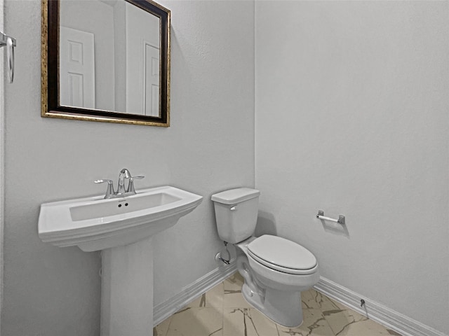 bathroom featuring toilet