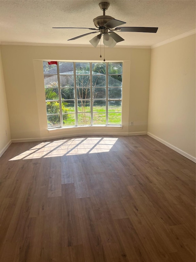 unfurnished room with crown molding, dark wood-type flooring, ceiling fan, and a textured ceiling