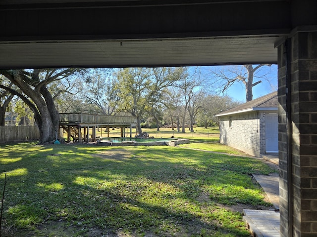 view of yard featuring a wooden deck