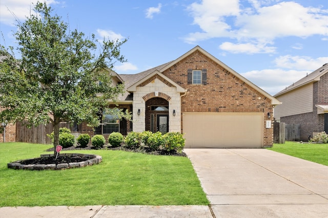 view of front facade with a garage and a front yard