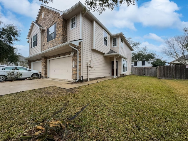 view of front of property with a garage and a front yard