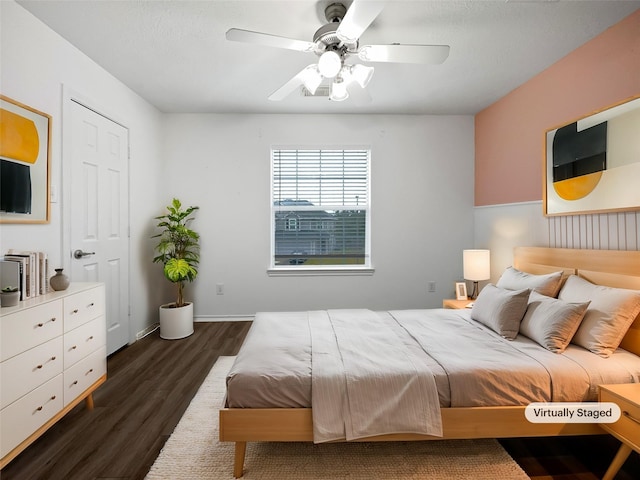 bedroom featuring ceiling fan and dark hardwood / wood-style floors