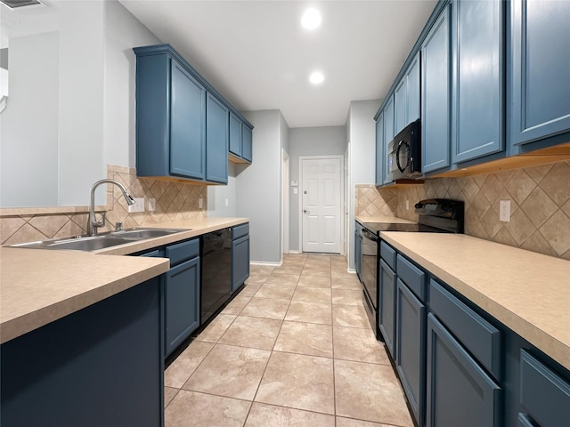 kitchen featuring light tile patterned floors, blue cabinets, sink, and black appliances