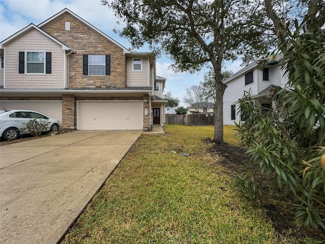 view of front of house featuring a garage and a front lawn