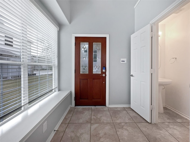 foyer featuring light tile patterned floors