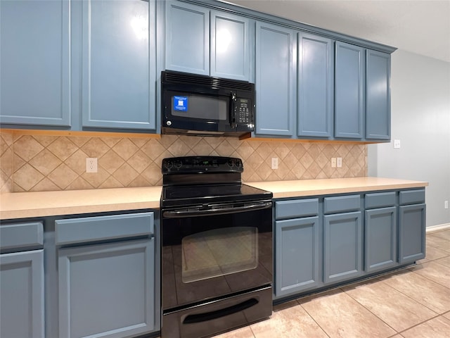 kitchen with tasteful backsplash, light tile patterned floors, and black appliances