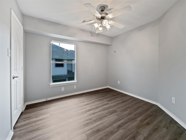 empty room featuring hardwood / wood-style flooring and ceiling fan