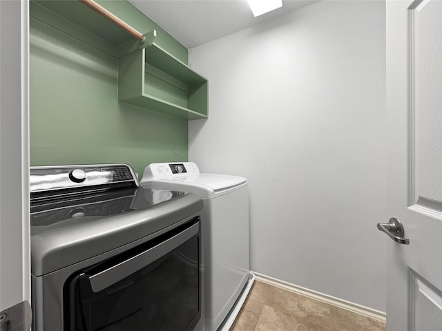 clothes washing area with independent washer and dryer