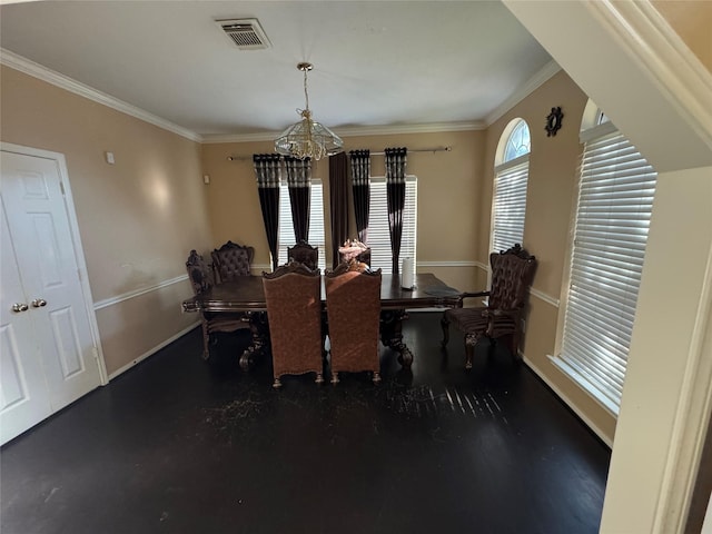 dining space with ornamental molding and a notable chandelier