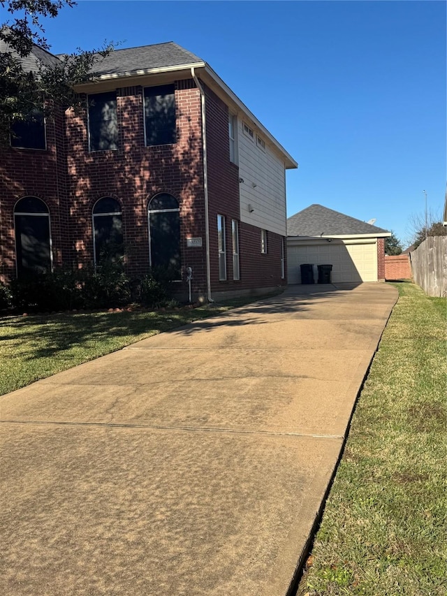 back of house with a lawn