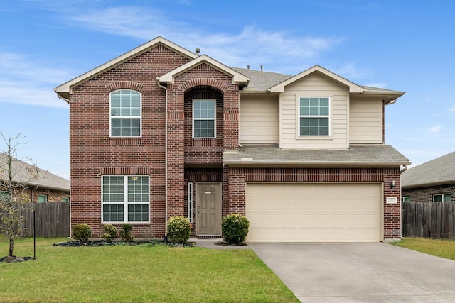 view of front of home with a garage and a front yard