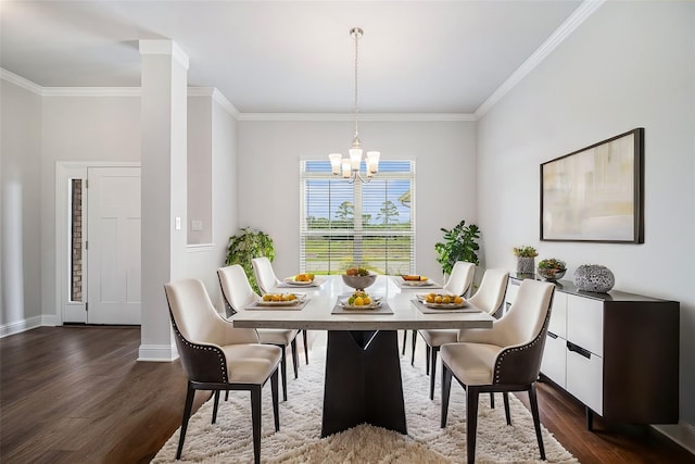 dining space with dark hardwood / wood-style flooring, crown molding, and an inviting chandelier