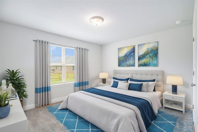 bedroom featuring dark colored carpet