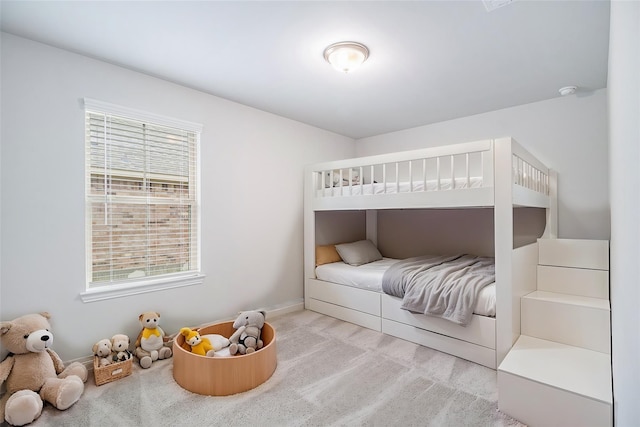 carpeted bedroom featuring multiple windows