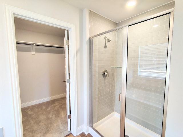 bathroom with a shower with shower door